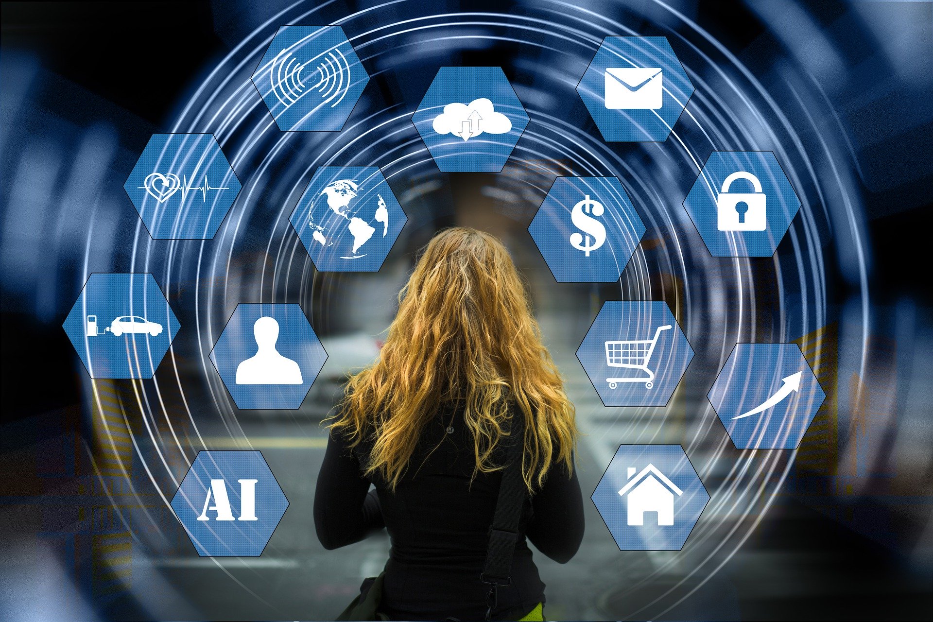 woman facing backwards to a background of various icons