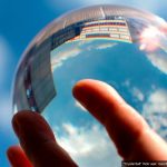 A hand holding a crystal ball